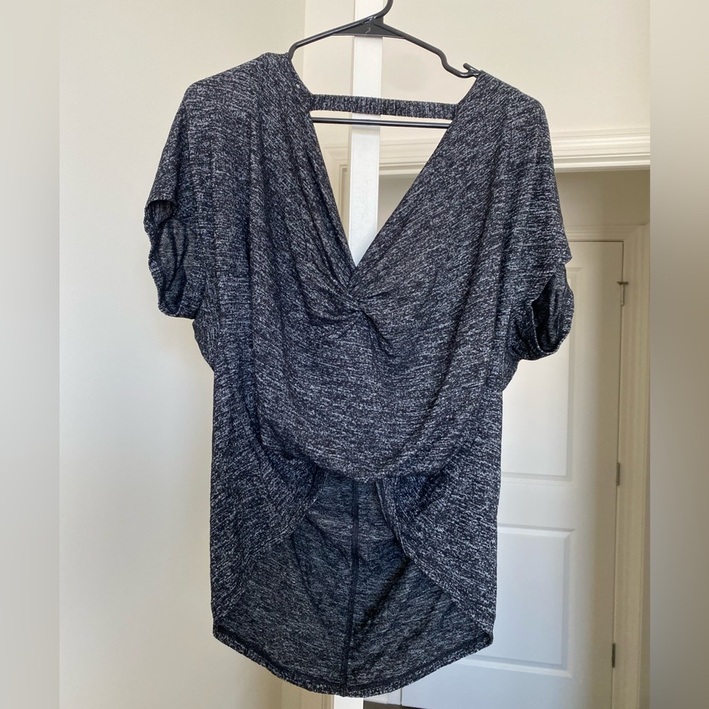 size medium black and grey open back shirt. Brand is express one eleven